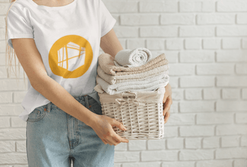 t-shirt-mockup-of-a-woman-holding-a-basket-of-clean-towels-34417-r-el2.png